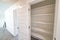 Close up of the empty linen closet of home with wide shelves for storage