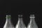 A Close up of empty plastic soft drink bottles on a black background