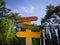 Close up empty road sings on forest background. Advice and information concept. Colorful wooden signboards