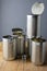 Close-up of empty stacked cans for recycling, on rustic wooden table, vertical