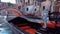 Close-up of empty venetian gondola on Venice canal