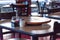 Close-up empty wooden table with rotating serving plate and shaker seasonings