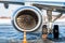 Close-up of engine of white passenger airplane