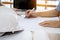 Close up of engineer hands discussing a building construction project with blank screen laptop at workplace, selective focus