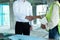 Close up engineer shaking hand with building contractor in construction site , successful negotiate of manager and industrial