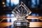 close-up of an engraved crystal award on a glass table