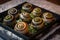 Close-up of Escargots, elegantly presented on a bed of rock salt with garlic butter and a sprinkle of parmesan cheese