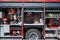 Close-up of essential firefighting equipment on a modern firetruck, showcasing tools and gear ready for emergency