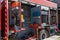 Close-up of essential firefighting equipment on a modern firetruck, showcasing tools and gear ready for emergency