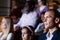 close up of european man sitting at film in cinema auditorium