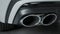 Close-up of exhaust pipes of new car. Action. Double exhaust pipe on new car model with luxury design. New Car parts