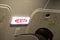 Close up of exit sign in passenger airplane.