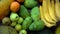 Close up of exotic fresh juicy fruits on wooden brown table background