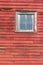 Close up exterior view of old weathered red 19th Century wooden barn