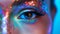 Close-up of an eye with colorful, sparkling makeup.