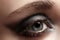 Close-up eye with dark gray eyeshadow