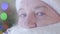 Close-up eyes of mature Caucasian Santa Claus looking away with tears on his eyes. Concept of sadness, sadness, lack of