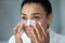 Close up face of African woman applying cleansing nose strip