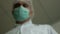 Close up face of an anesthesiologist doctor before surgery at the end of the video, out of focus loss of consciousness anesthesia