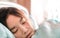 Close up face of beautiful illness asia patient women being sick and sleep in patient room affter treatment by doctor and