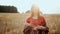 Close up face beautiful woman on field wheat on sunset, countryside smiling look at camera. Organic products concept