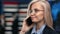 Close up face of blonde woman manager calling smartphone consulting deal profit at hi tech office