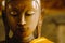 Close up face on buddha head statue with lighting effect.