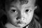 Close-up face of Cambodian boy. Black and White.