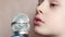 Close-up face of Caucasian preschooler singing into microphone. The child sings in karaoke at home. The little singer is learning