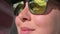 Close-up face of caucasian young woman in sunglasses smiling. Portrait of a stylish traveler girl in slow motion