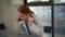 Close-up face of cheerful female doctor wearing white coat talking on mobile phone with patient during remote distant