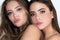 Close up face cute charming models. Fashion portrait of two girls with natural makeup. Sensual elegant women. Skincare
