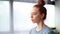 Close-up face of focused redhead young woman doing breathing yogic practices at home office.