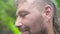 Close up face handsome bearded man looking to camera and smiling. Portrait adult man with bristly face.