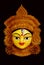 A close up on the face of an idol of Goddess Durga