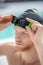 Close-up face of man in swimming cap and glasses