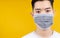 Close up Face of man wearing medical mask protection against germs from crisis coronavirus, covid-19 and prevent infection on yell