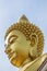 Close up the face of Phra Buddha Dhammakaya Thepmongkhon,the large outdoor golden Buddha image at Wat Paknam Phasi Charoen,Bangkok
