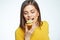 Close up face portrait of happy woman eatin macaron French cake