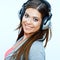 Close up face portrait of woman with headphones listening music