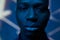 Close-up of face of serious black man standing in front of camera