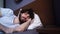 Close-up face of sleeping young man opening eyes, waking up and happy looking away.