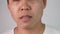 Close-up face of a sleepy and yawned young man on white background.