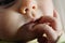 Close-up of the face of a worried baby, macro portrait