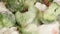 Close-up of falling frozen vegetables in a frying pan. Roasting vegetables for a vegan dinner. Frozen food