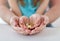 Close up of family hands holding euro money coins