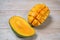 Close up of famous sweet mango called Harum Manis isolated on top of wooden background