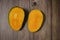 Close up of famous sweet mango called Harum Manis  on top of wooden background