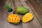 Close up of famous sweet mango called Harum Manis  on top of wooden background