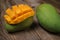 Close up of famous sweet mango called Harum Manis  on top of wooden background